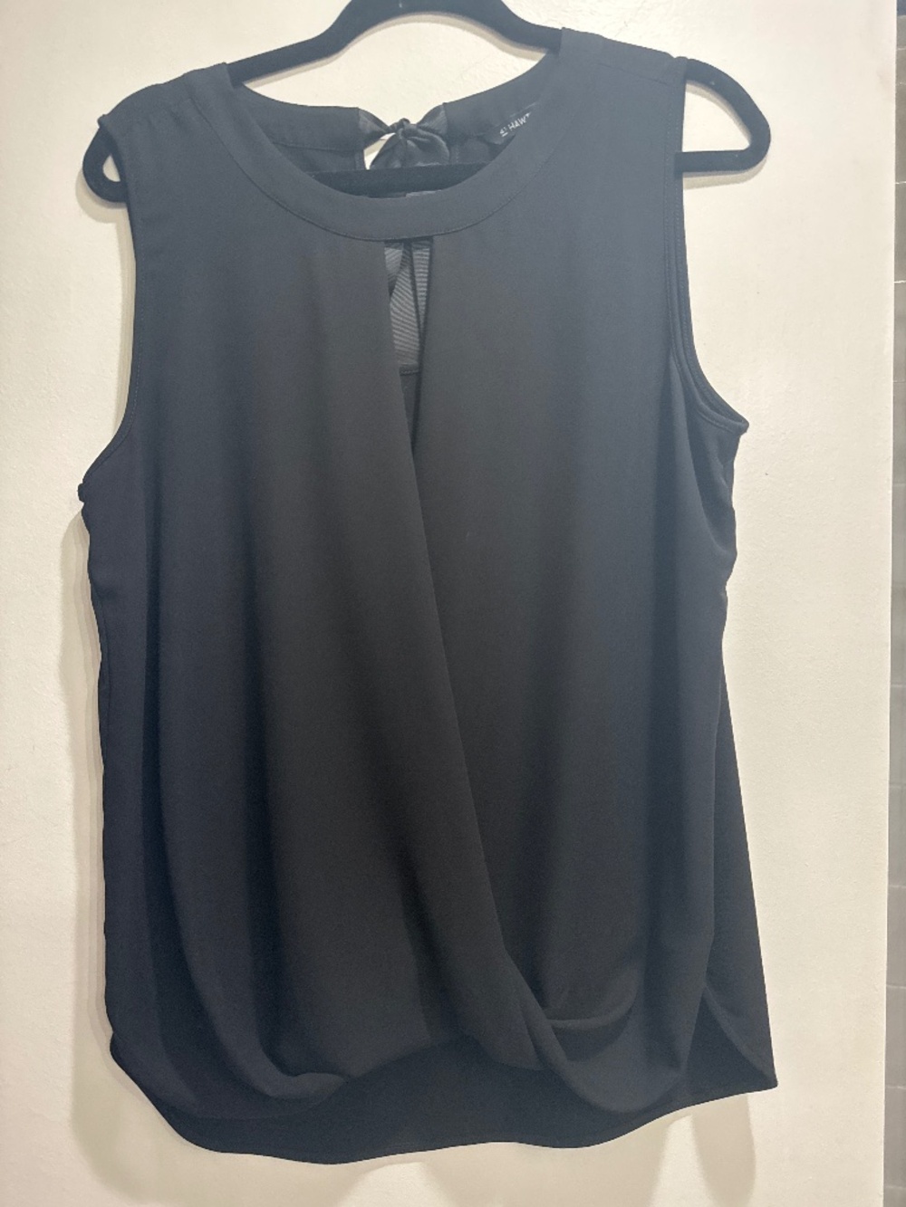 Black sleeveless blouse | Peekaboo v-neckline that ties in the back
